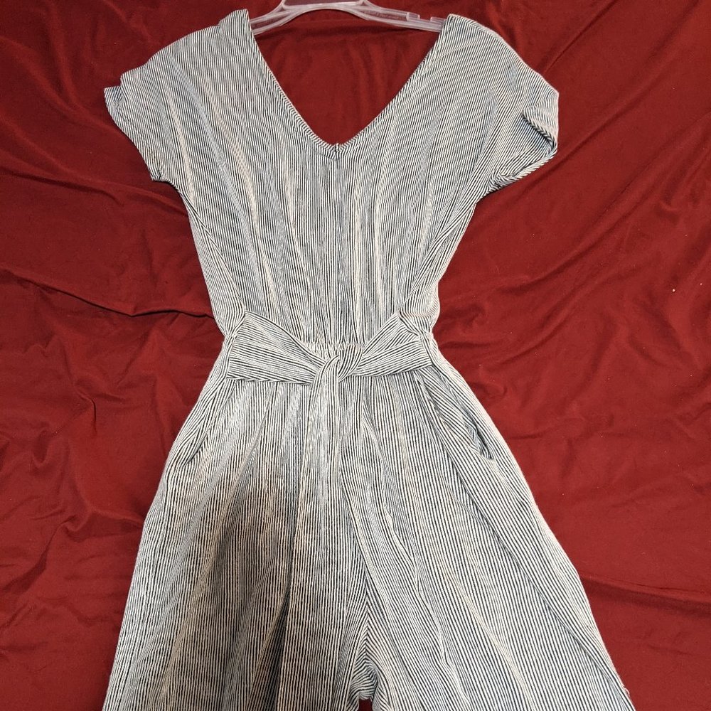 Black and white jumpsuit with belt and pockets